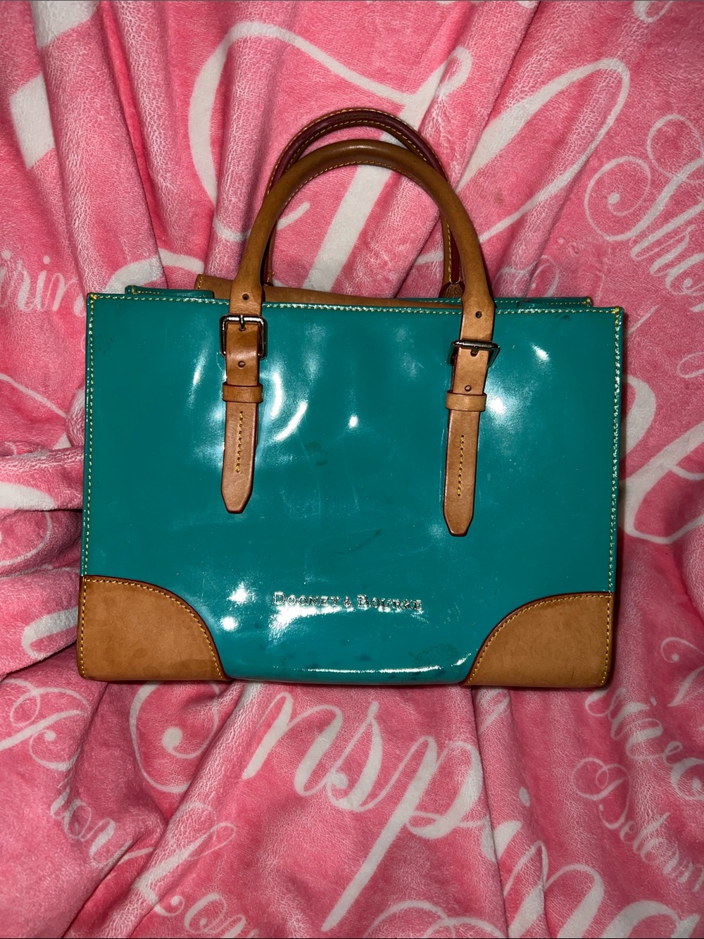 Dooney and Burke green patent leather color transfer on the front and the back